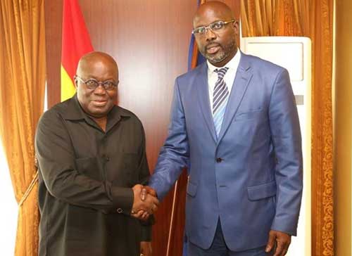 President Akufo-Addo (R) with Liberia President-Elect George Weah. File image