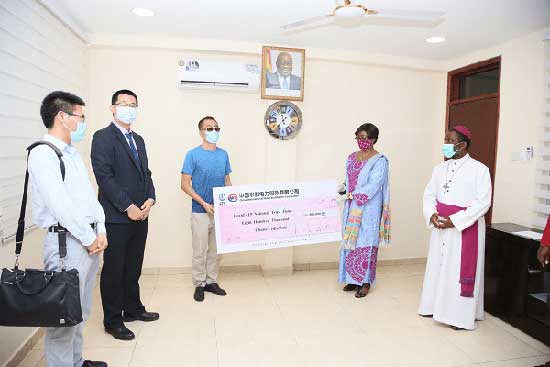 Justice Sophia Akuffo (2nd right) receiving the cheque from Mr Du Honglai (3rd left). Picture: SAMUEL TEI ADANO