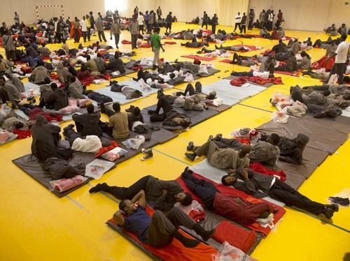  African migrants rest inside a temporary shelter at a sport center on in Tarifa, Spain.